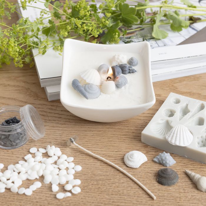 Ljusfat med strandsnäckor