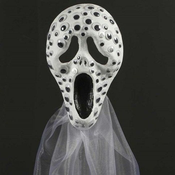 Mask, dekorerad med rörliga ögon och organzatyg