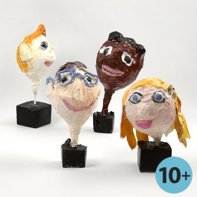 Huvuden med ansikten, gjorda av ballong med papier-mach&eacute;