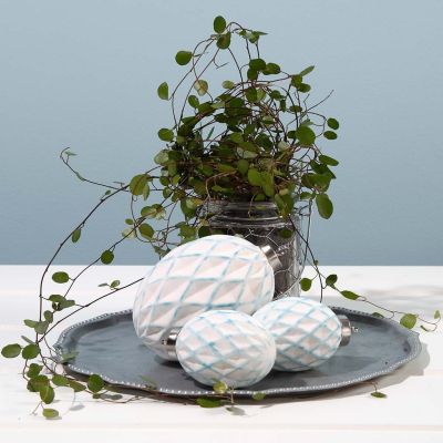 Terrakottakula med harlekinmönster i relief